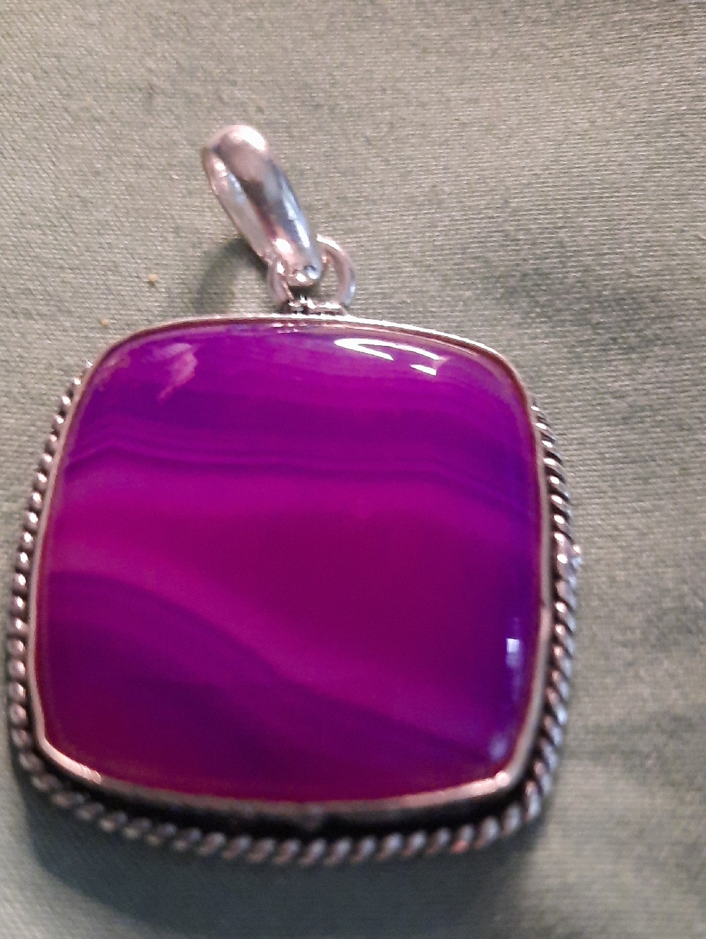 cushion-cut Botswana agate pendant set in sterling silver.